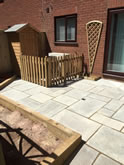New patio in Exeter with a small picket fence