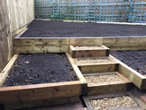 New garden landscape project including the construction of garden steps, flowerbeds and garden decking
