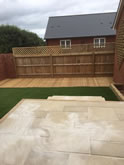 New patio in Exeter with a small picket fence