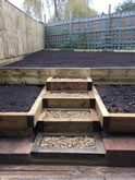 New garden landscape project including the construction of garden steps, flowerbeds and garden decking